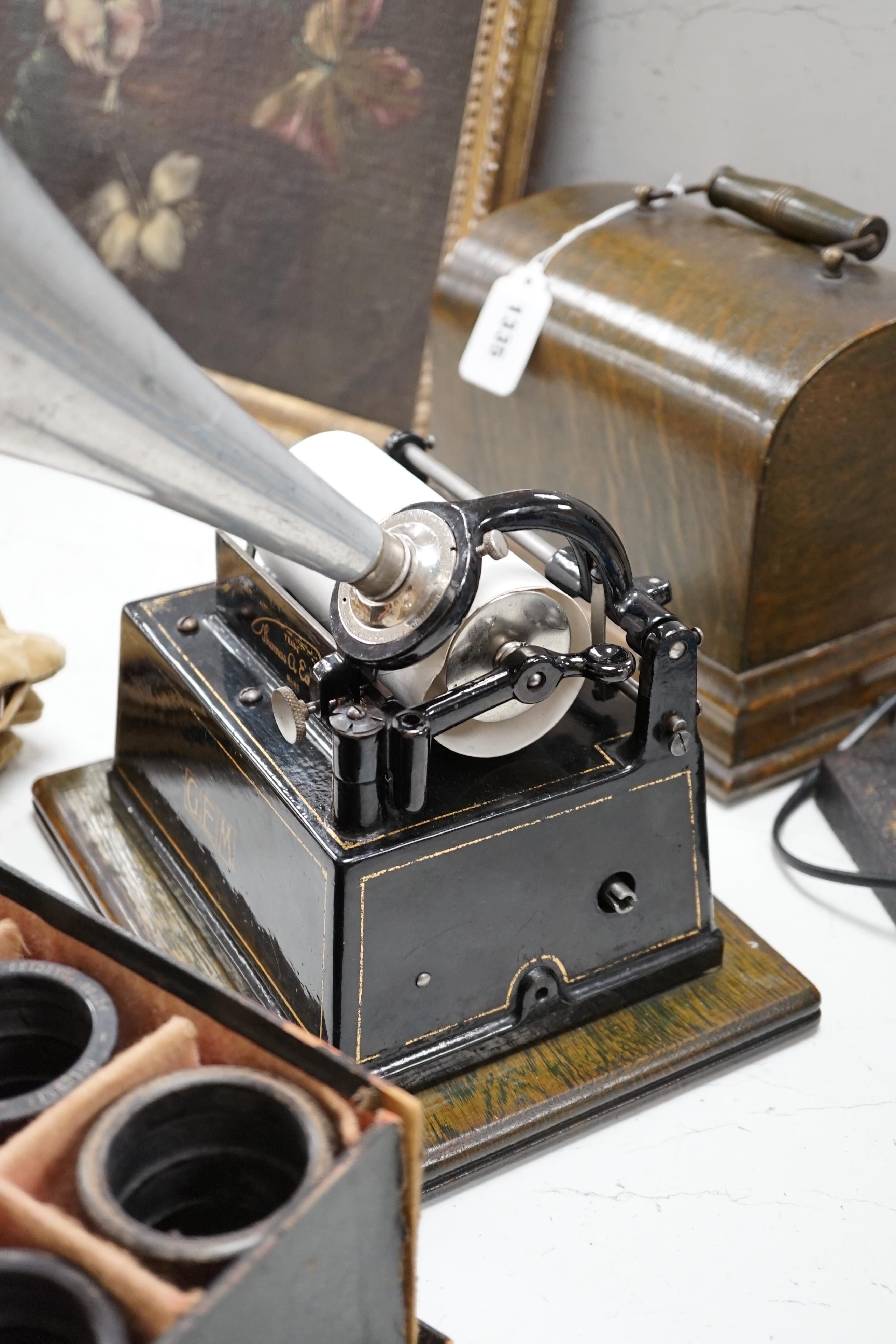 An oak cased Edison Little Gem phonograph with zinc horn and an original card box containing nineteen cylinders